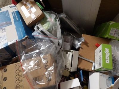 a pile of boxes and other items that are on the floor