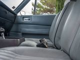 a picture of the inside of a car with a cup holder in it