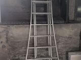 a ladder that is leaning against a toilet in a bathroom