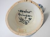 a cup with a writing on it that says keralic