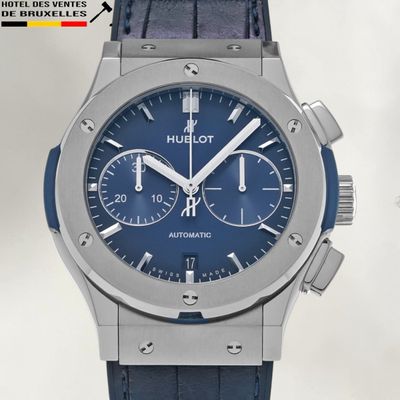 the watch has a blue dial on the face of it