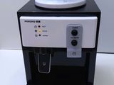 a water dispenser that is sitting on top of a table