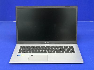 un ordinateur portable ouvert posé sur une surface bleue