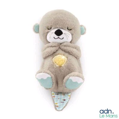a stuffed animal that is laying down on a white surface