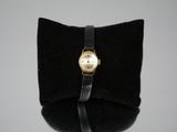 an image of a wrist watch on a black velvet case