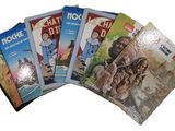 plusieurs livres pour enfants sont alignés sur une surface blanche