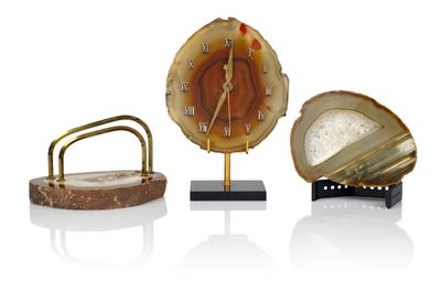 three different clocks that are sitting on top of each other