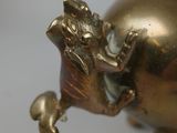 a gold elephant statue on a white background