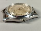 a watch that is sitting on a white surface