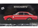 the box is open to show the model of a red car