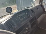 dashboard of a truck with a steering wheel and dashboard controls