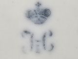 an image of a white plate with a crown on it
