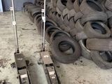 a pile of tires sitting on the floor in a warehouse