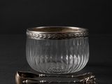 bowl with spoon and spoon rest on a black surface