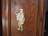 a wooden cabinet with a picture of a man on it