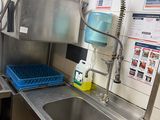 a kitchen with a sink and a dishwasher in it