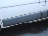 a white truck parked on the side of the road