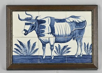 a picture of a blue and white tile with a cow on it
