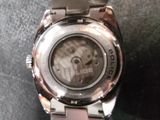 a close up of a wrist watch on a table