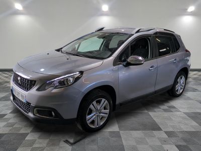 a picture of a silver car on a checkered floor