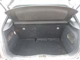 a trunk of a car with the back seat folded down