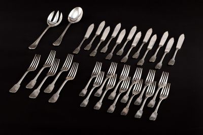 a lot of forks and spoons on a black table