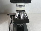 an image of a close up of a microscope on a table