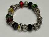 a close up of a bracelet on a white surface