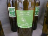 several bottles of wine are lined up on a table