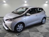 a picture of a silver toyota aygo parked on a checkered floor