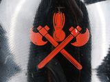a picture of a tie with two crossed axes on it