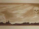 a picture of a drawing of a skull on a wall