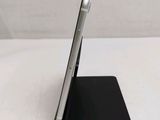 a cell phone that is sitting on top of a stand