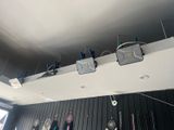 many different items hanging on the ceiling of this room