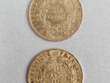 two gold coins, one of which is a sovereign and the other of which is a sovereign