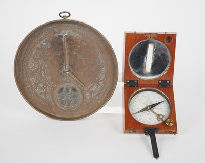 a clock that is sitting next to a mirror on the wall