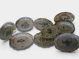 a lot of plates that are sitting on a table