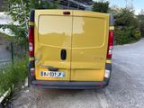 a yellow van that is parked on the side of the road