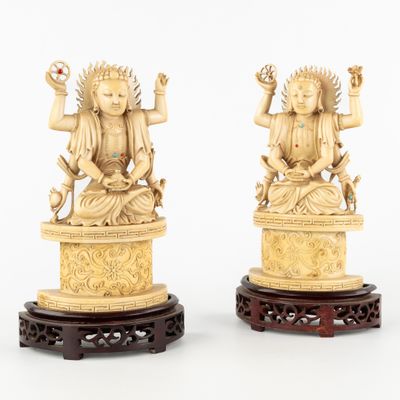paire de figurines chinoises en ivoire sculpté représentant des bouddhas