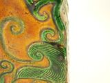a close up of a vase with a design on it
