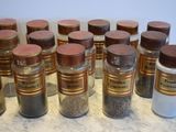 a lot of spices in the jars on the counter