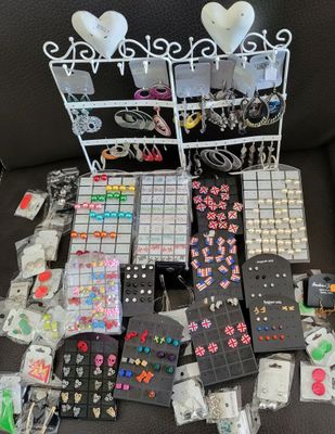many different types of jewelry on display on the couch