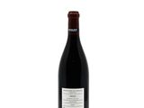 a bottle of red wine on a white background