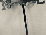 a clock with a weather vane attached to it ' s side