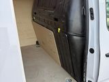 a white van with the door open on the side of the road