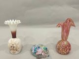 three vases sitting next to each other on a table