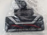a close up of a vacuum cleaner in a bag on a table