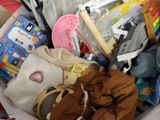 a basket full of children ' s clothing and toys