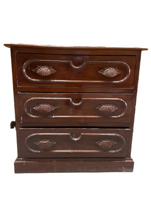 an image of a wooden chest of drawers on a white background