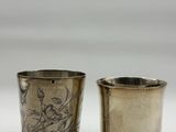pair of antique silverplated shot glasses with birds on them